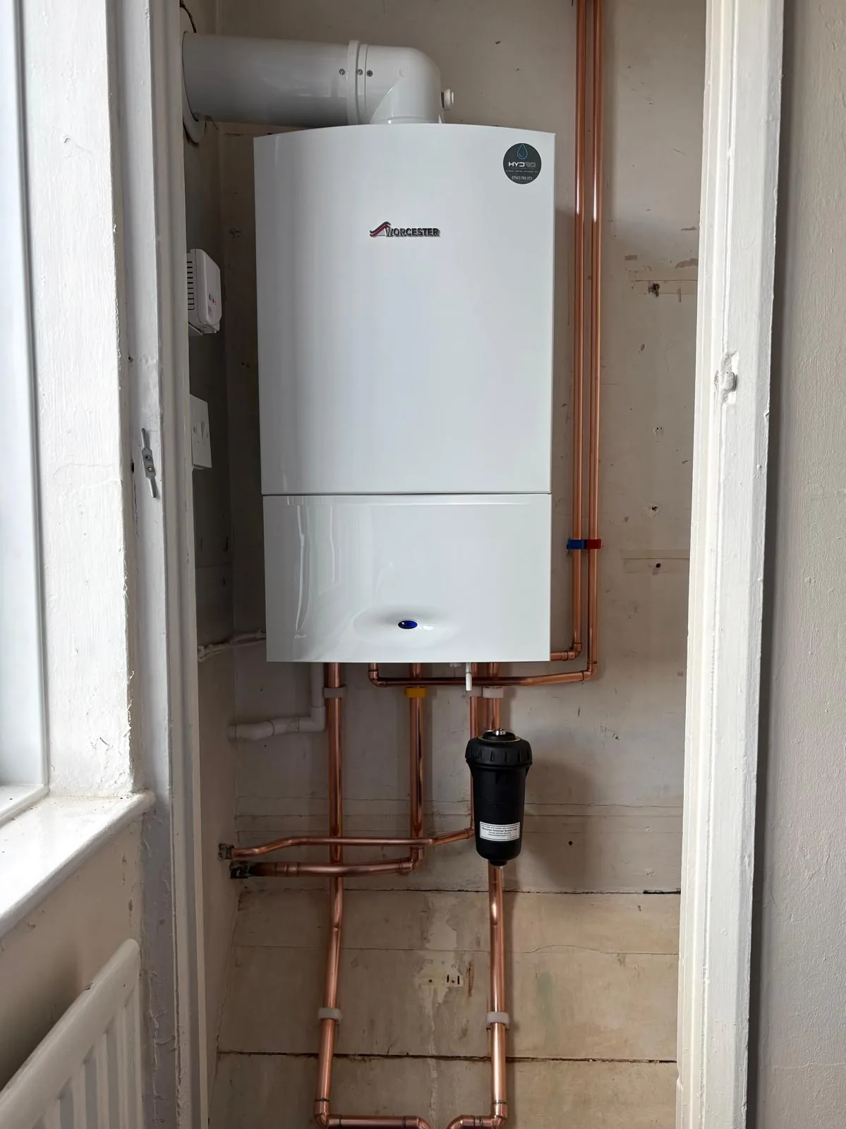Completed boiler installation in a utility space